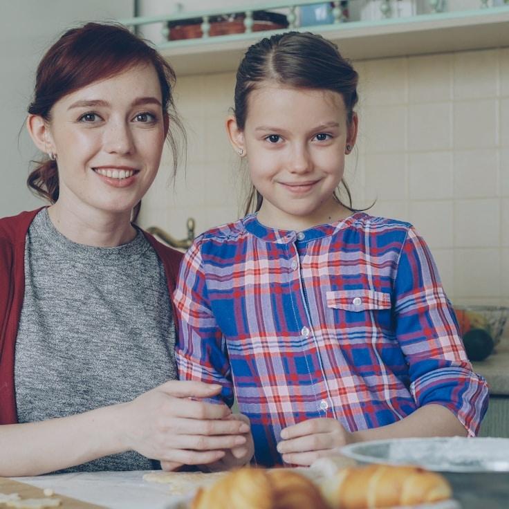 Kaveri Mehta, Lead Design Curator at Silent River Projects, reviewing corporate floral arrangements